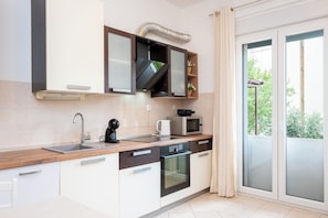 Apartment (A1) | Private kitchen | Fridge, microwave, oven, stovetop - Apartment Karmen (Split)
