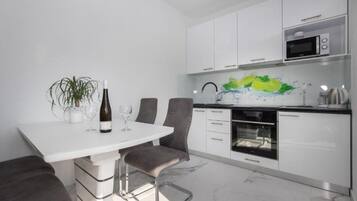 Apartment (A1) | Private kitchen | Fridge, microwave, oven, stovetop