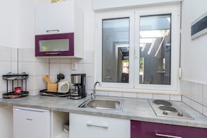 Apartment (A5) | Private kitchen | Fridge, stovetop, electric kettle, cookware/dishes/utensils - Apartments Javi (Trogir)