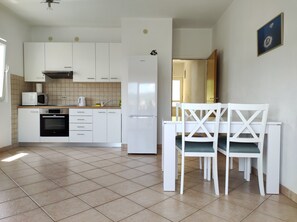 Apartment (A1) | Private kitchen | Fridge, microwave, stovetop, cookware/dishes/utensils - Apartments Marijan (Sali)