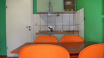 Apartment (A2) | Private kitchen | Fridge, stovetop, electric kettle, cookware/dishes/utensils