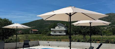 Outdoor pool, pool umbrellas, pool loungers