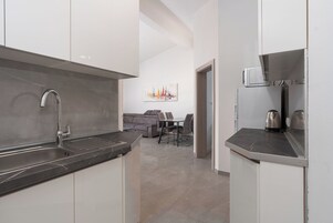 Apartment (A2) | Private kitchen | Fridge, microwave, stovetop, cookware/dishes/utensils