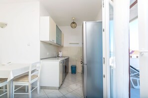 Apartment (A3) | Private kitchen | Fridge, stovetop, espresso maker, electric kettle - Apartments Terrace (Postira)