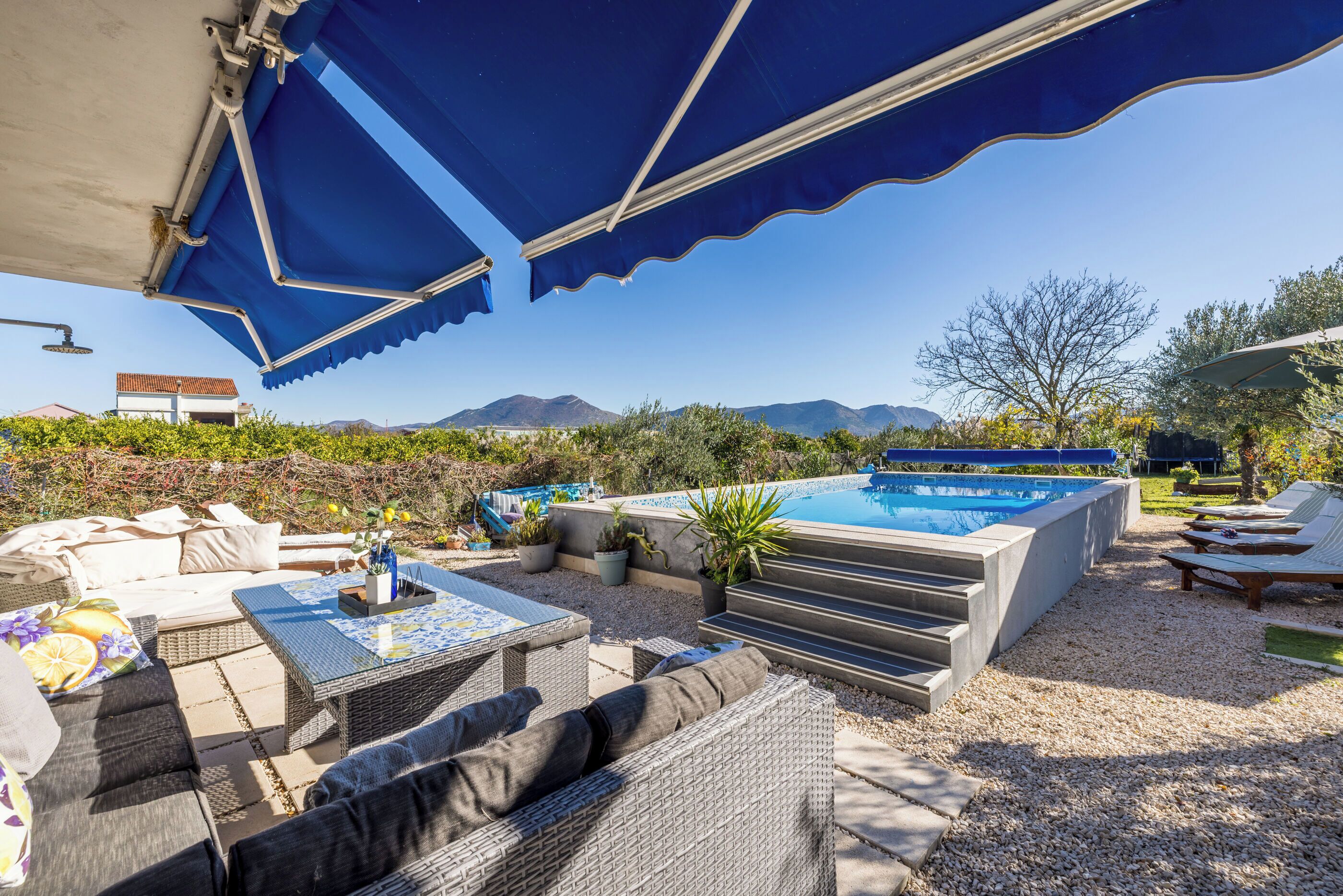 Outdoor pool, a heated pool, open open 24 hours a day, pool umbrellas