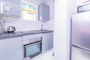 Apartment (A2) | Private kitchen | Fridge, microwave, oven, stovetop - Apartments Fenix (Primosten)