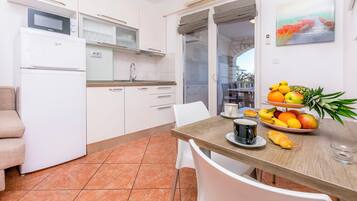 Apartment (A1) | Private kitchen | Espresso maker, fridge, microwave, stovetop