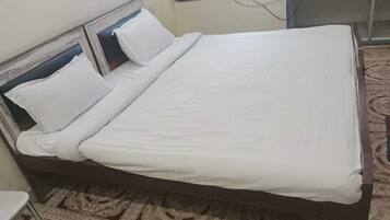 Desk, laptop workspace, free WiFi, bed sheets