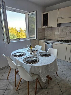 Apartment (A1) | Private kitchen | Fridge, microwave, stovetop, dishwasher - Apartments Sea and Pine (Jelsa)