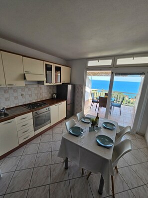 Apartment (A2) | Private kitchen | Fridge, microwave, stovetop, dishwasher - Apartments Sea and Pine (Jelsa)