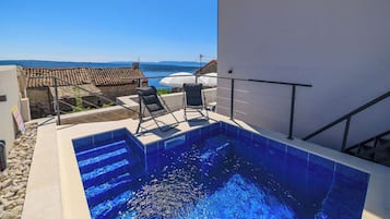 Outdoor pool, pool umbrellas, pool loungers