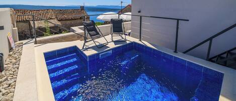 Outdoor pool, pool umbrellas, pool loungers