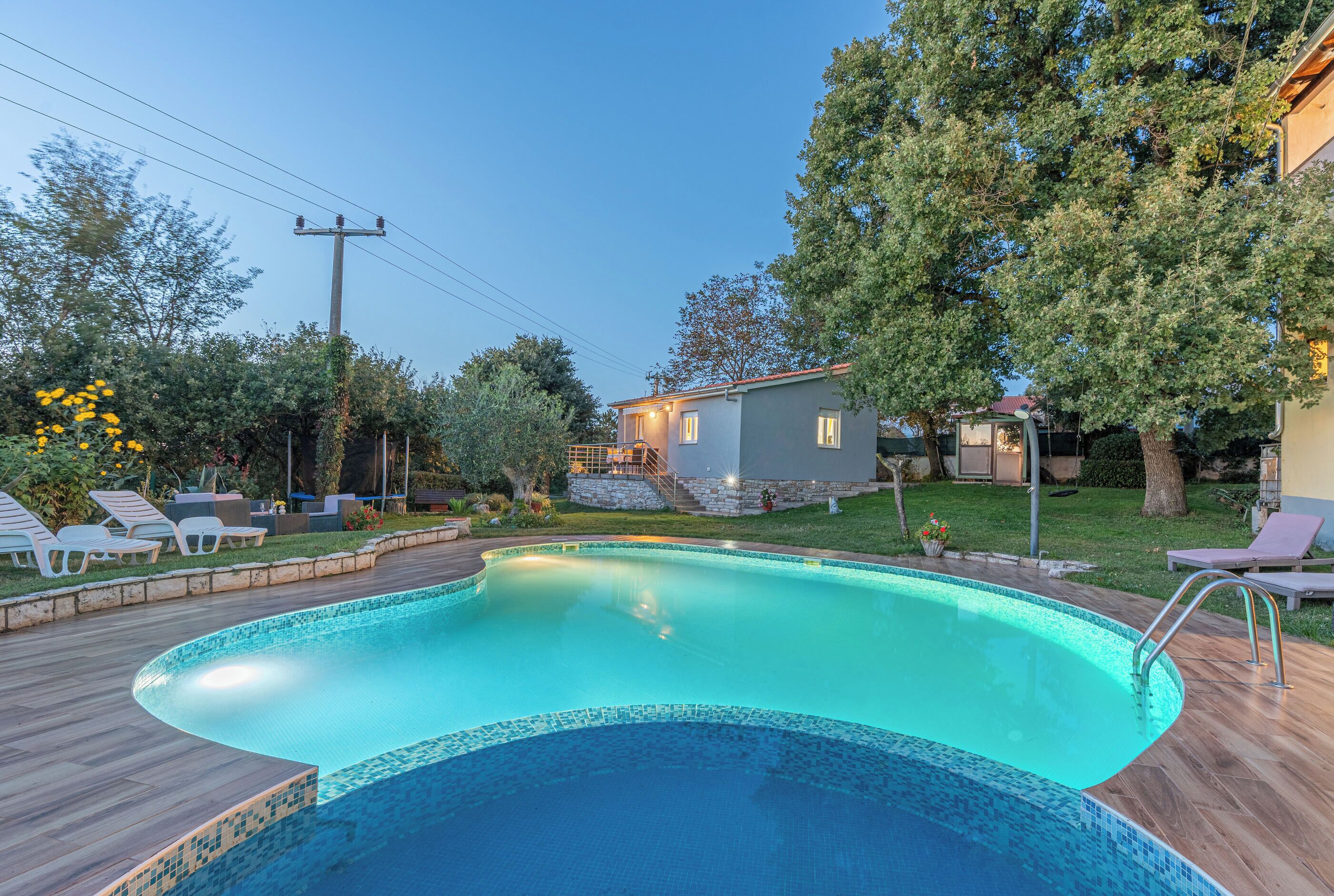 Outdoor pool, an infinity pool, open open 24 hours, pool umbrellas