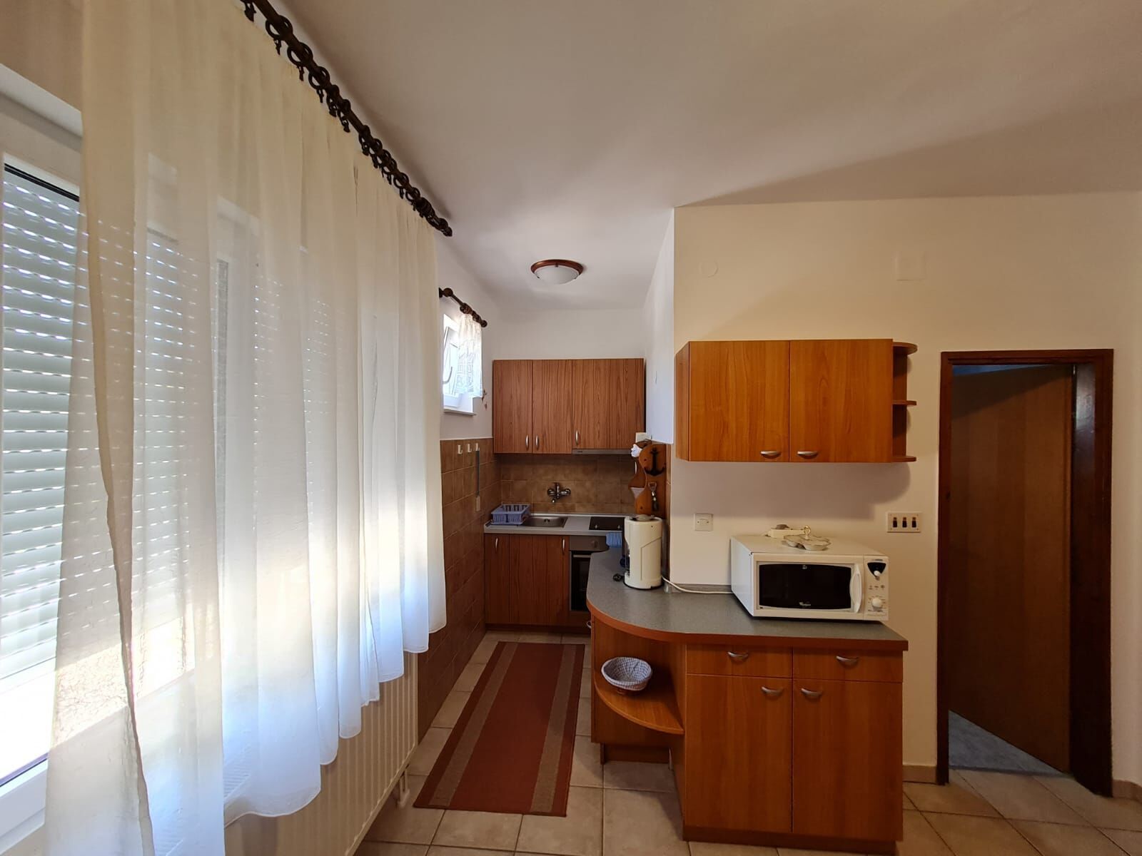 Apartamento (A1) | Cocina privada | Frigorífico, horno, placa de cocina y máquina de café espresso