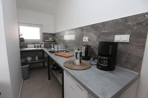 Appartamento (A3) | Cucina privata | Frigorifero, piano cottura, macchina per caffè espresso