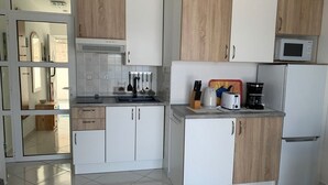 Apartment (A3) | Private kitchen | Fridge, microwave, stovetop, electric kettle - Apartments Draga (Sibenik)