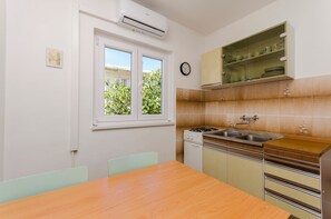 Apartment (A2) | Private kitchen | Fridge, stovetop, electric kettle - Apartments Bepo i Marija Pag (Pag)
