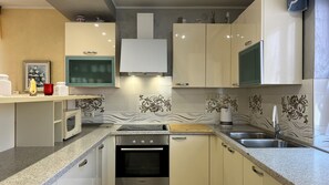 Appartement (A1) | Cuisine privée | Cafétière à espresso, cafetière-théière, réfrigérateur