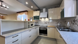 Appartement (A1) | Cuisine privée | Cafétière à espresso, cafetière-théière, réfrigérateur