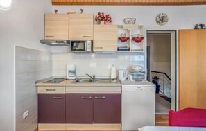 Apartment (A1) | Private kitchen | Fridge, microwave, stovetop, electric kettle - Apartments Duga (Crikvenica)