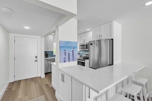 Fridge, microwave, stovetop, dishwasher - Nautilus #111 by Duncan Real Estate (Holmes Beach)