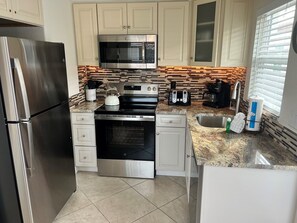 Dishwasher, coffee/tea maker, toaster, cookware/dishes/utensils