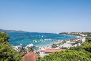 A coastal town with a marina, beach, and clear blue sea. - Apartments Immortelle (Biograd na Moru)