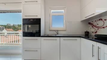 Apartment (A3) | Private kitchen | Fridge, oven, stovetop, dishwasher