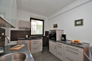 Apartment (A3) | Private kitchen | Fridge, stovetop, dishwasher, espresso maker