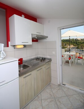 Apartment (A2) | Private kitchen | Fridge, stovetop, espresso maker, electric kettle - Apartments Huljev (Primosten)