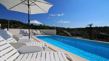 Outdoor pool, pool umbrellas, pool loungers