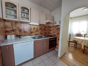 Apartment (A1) | Private kitchen | Fridge, microwave, oven, stovetop - Apartment Kruno (Crikvenica)