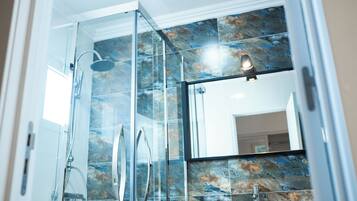 Shower, towels, soap, toilet paper