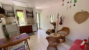 A compact living space with a kitchen, dining area, and seating area. - House Kornati Robinzon (Murter-Kornati)