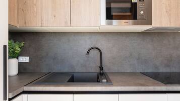 Fridge, microwave, stovetop, cookware/dishes/utensils