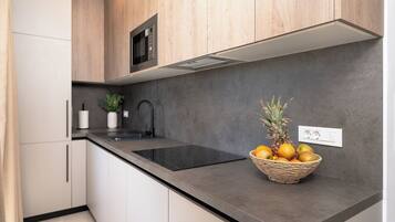 Fridge, microwave, stovetop, cookware/dishes/utensils