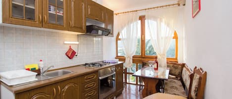 Apartment (A4) | Private kitchen | Fridge, microwave, oven, stovetop