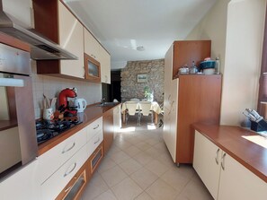 Apartment (A1) | Private kitchen | Fridge, microwave, oven, stovetop - Apartment Niki (Vinodol)