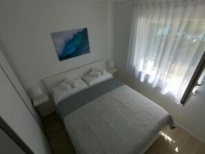 Apartamento (A1) | Ferros/tábuas de passar roupa, berços grátis, Wi-Fi de cortesia