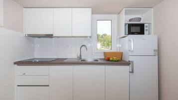 Casa | Cucina privata | Frigorifero, microonde, piano cottura, lavastoviglie