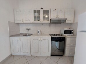 Apartment (A2) | Private kitchen | Fridge, microwave, oven, stovetop - Apartment Ankica (Punat)