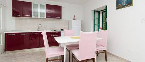 Apartment (A1) | Private kitchen | Fridge, microwave, stovetop, dishwasher