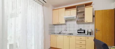 Apartment (A4) | Private kitchen | Fridge, microwave, stovetop, espresso maker