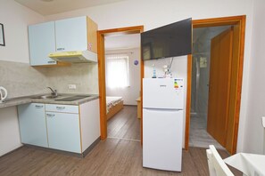Apartment (A5) | Private kitchen | Fridge, microwave, stovetop, electric kettle - Apartment Marigold (Sveti Filip i Jakov)