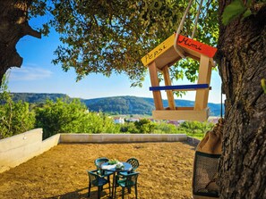 A treehouse with a wooden structure and a sign that reads "Pepsi."