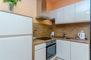 Apartamento (A2) | Cozinha privada | Geladeira, fogão, cooktop, lava-louças