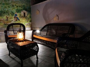 A room with wicker furniture, a mural, and a tiled floor. - House Luketini Dvori (Marina)