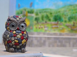 A mosaic owl sculpture on a concrete surface. - House Luketini Dvori (Marina)