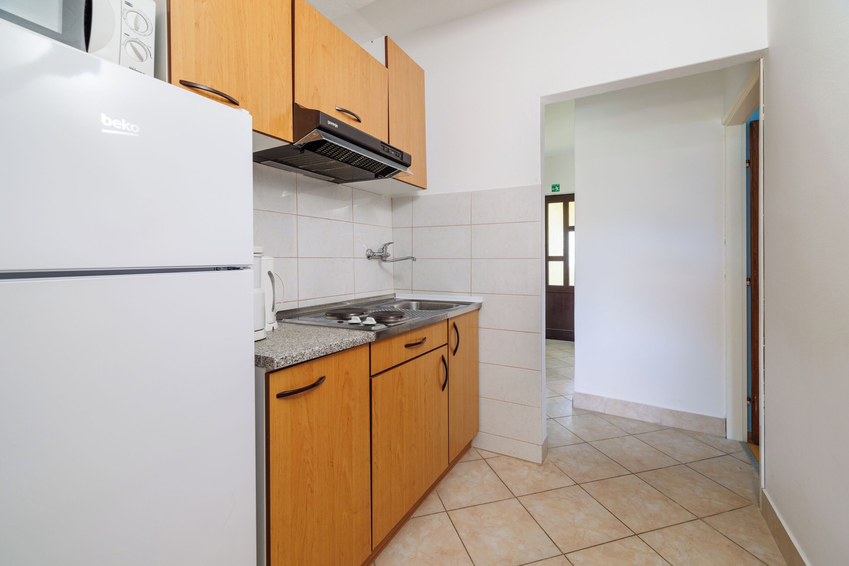 Apartamento (A1) | Cozinha privada | Geladeira, micro-ondas, cooktop, máquina de café expresso