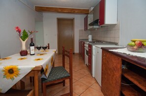 Apartment (A1) | Private kitchen | Fridge, oven, stovetop, electric kettle - Apartments Lovran (Lovran)